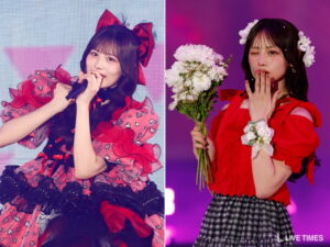 Two female performers on stage in red outfits: left sings into a microphone in a heart-patterned pink dress with a large red bow; right holds a bouquet, winks, wearing a red top with a floral crown and checkered skirt.